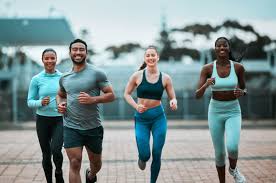 Sculpting Sleek Arms: The Essential Role of Cardio in Toning Without Bulking Up 3 image of people running to incorporate cardio Nantwich exercise into their life to help tone arms and body.