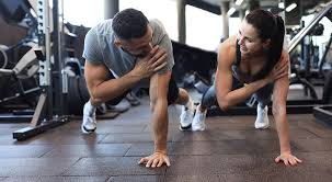 Image of man and woman doing Cardio Nantwich to tone their arms. 